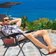 This guy is using the chair the way it was meant to be used: outdoors. The fool.